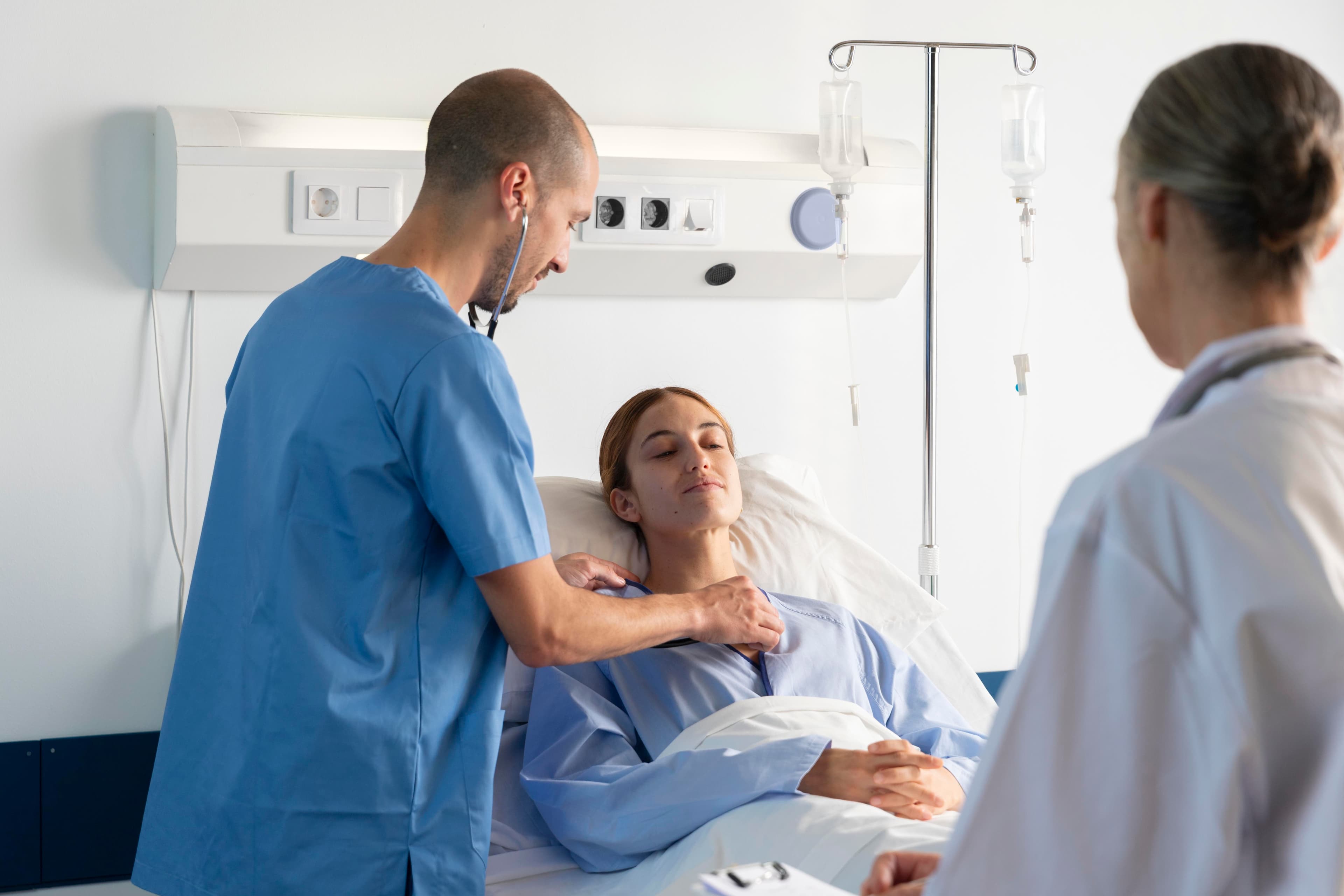 Medical team speaking with a patient